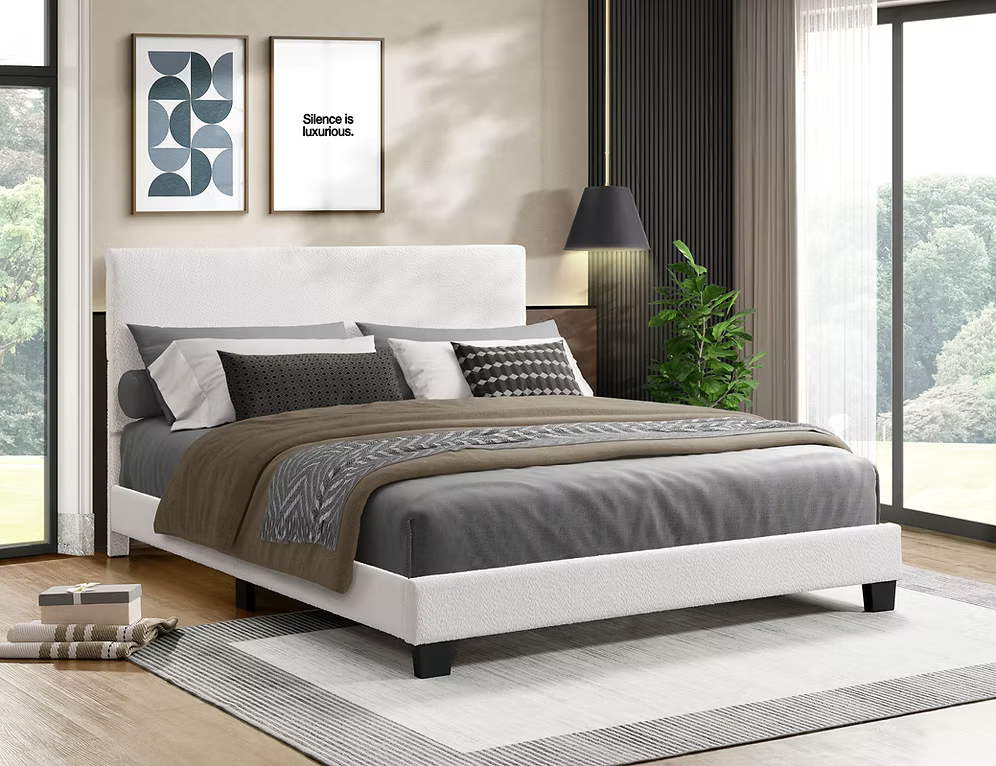 Contemporary upholstered bed frame with a minimalist headboard in a modern bedroom.