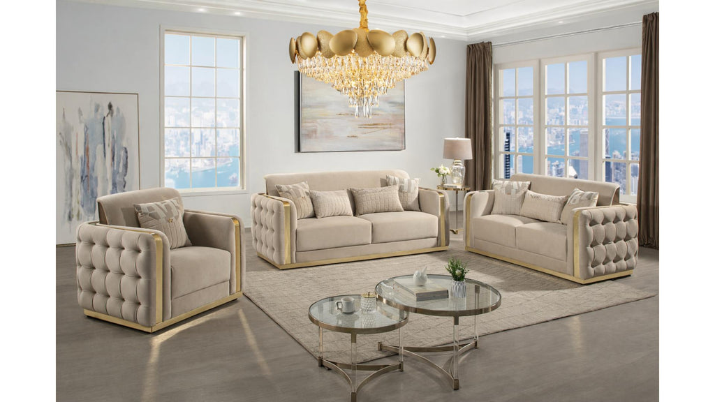 Morvix luxury living room furniture set featuring a contemporary tufted sofa, loveseat, and armchair in a soft neutral-toned fabric with sleek gold frame accents