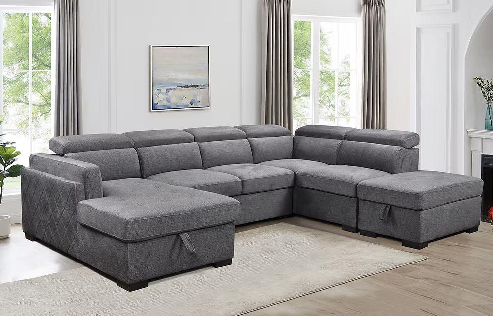 Natali modern soft grey fabric left-hand facing sectional sofa bed featuring adjustable headrests, an open bed configuration, and a lift-up storage ottoman