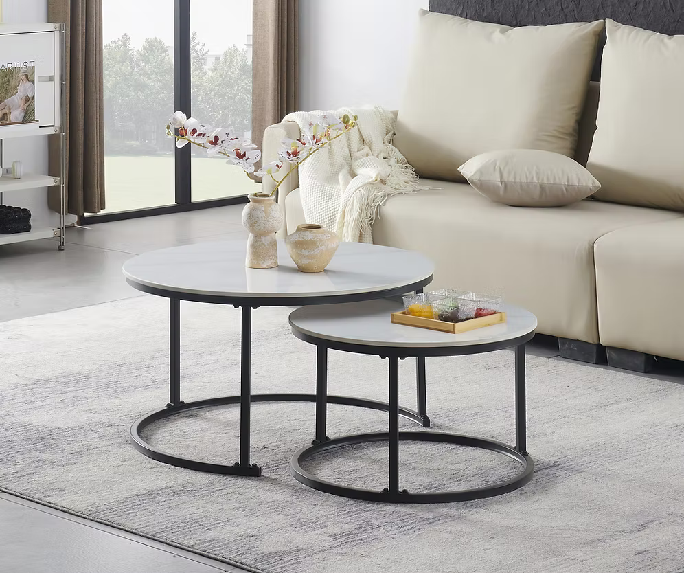 Emma modern nesting coffee table set featuring snowy white sintered stone marble tops and round black steel nested frames
