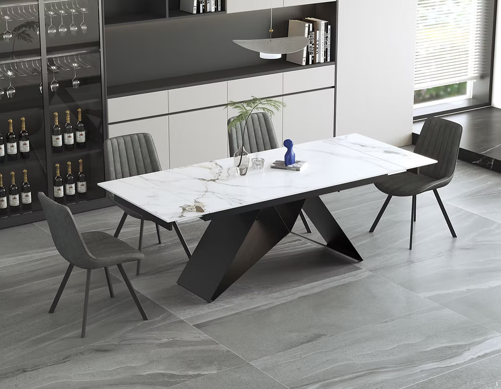 Lilly extendable dining table with a white vein-matched sintered stone marble top and an X-shape black steel base shown in a contemporary dining room