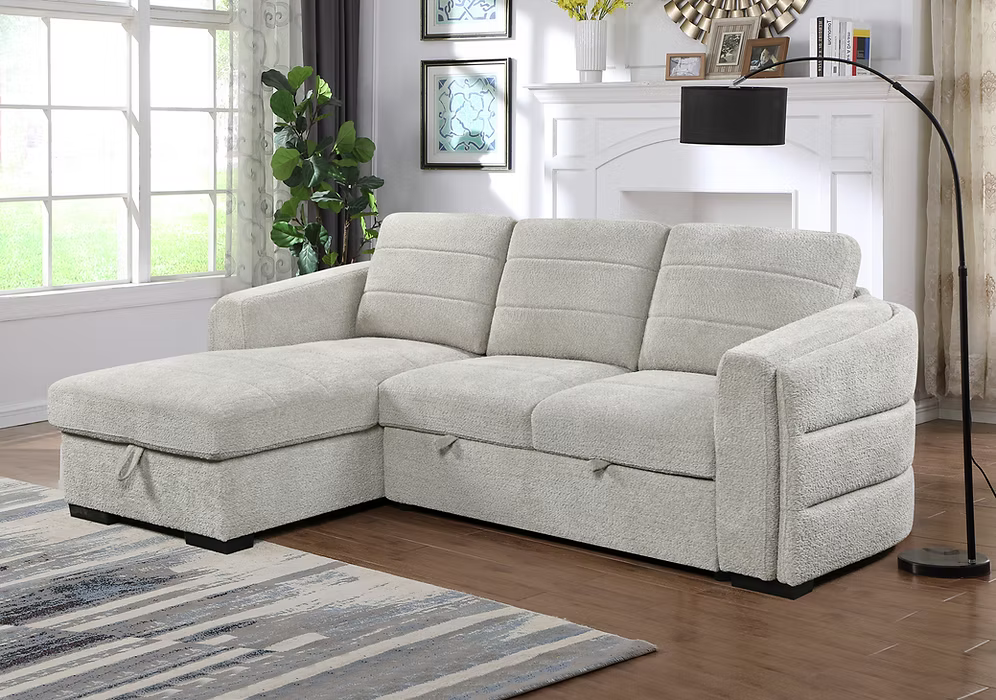Victoria left-hand facing sectional sofa bed in light grey bouclé textured fabric featuring horizontal tufting, a rounded backrest, pull-out bed mechanism, and open storage chaise