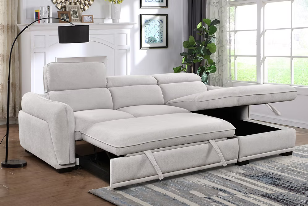 Nina modern right-hand facing sectional sofa bed in light grey fabric featuring adjustable headrests, a tufted seat design, and an open lift-up storage chaise